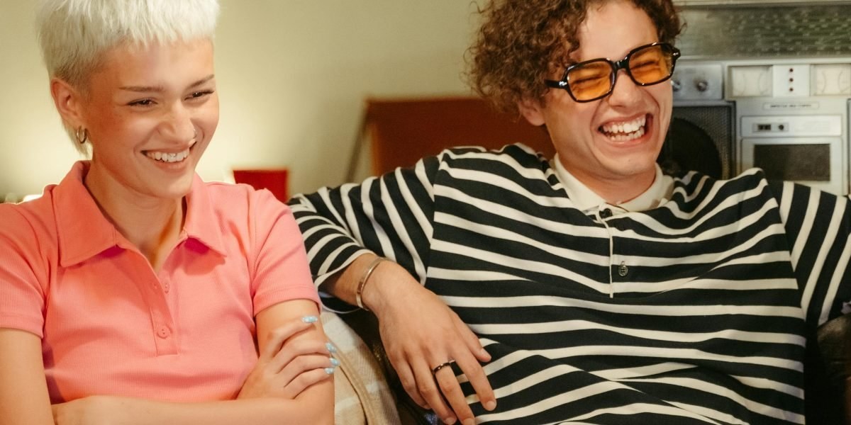 Two people having a supportive conversation on a sofa