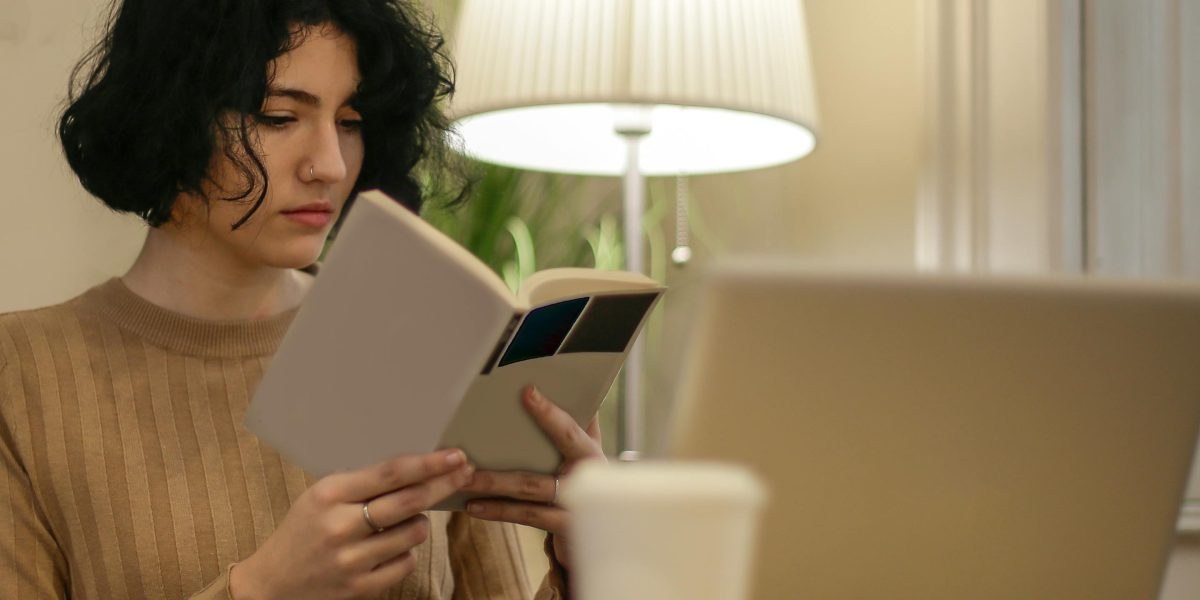 Person reading a mental health resource on a laptop