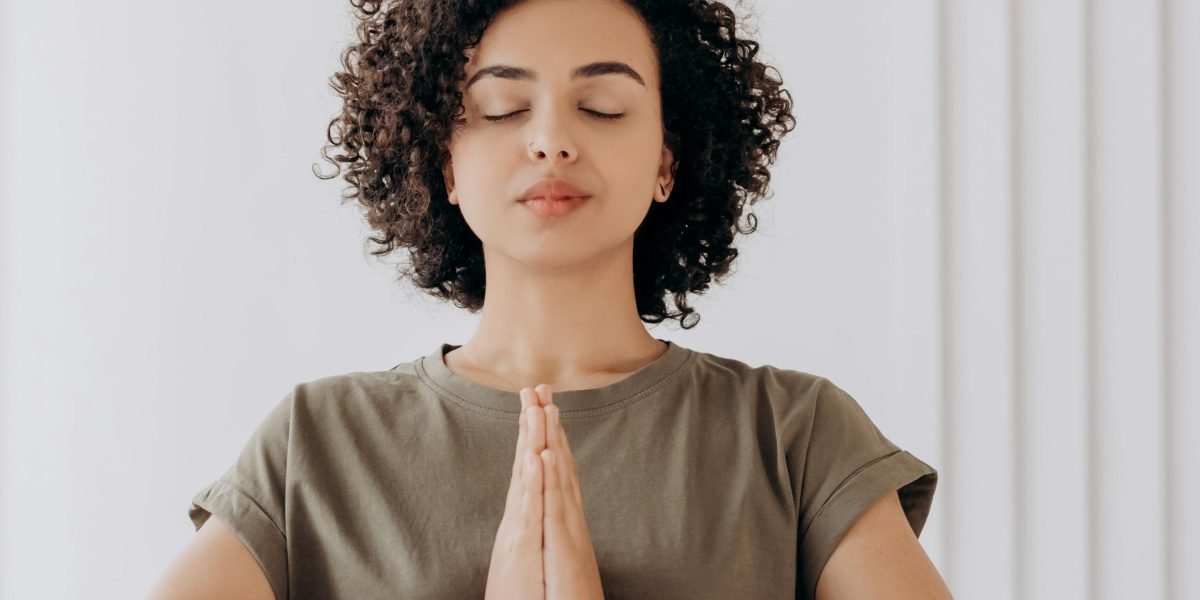 A person practicing mindfulness, reflecting a calm and focused approach to observing emotions without judgment.