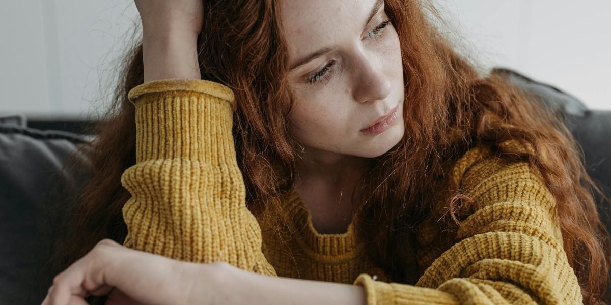 Illustrating the emotional burden of mental health stigma, where individuals feel unable to openly discuss their struggles due to fear of judgment.