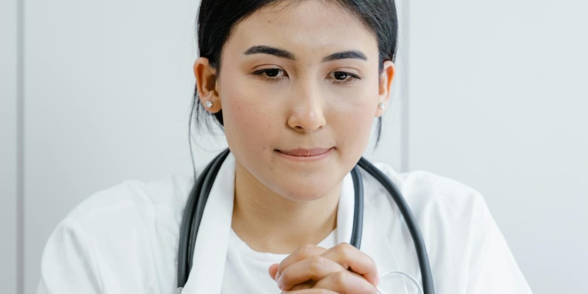 A healthcare professional in a serious discussion with a patient, representing the diagnostic assessment process for ASPD.