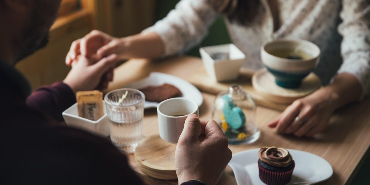 A couple engages in a serious conversation, reflecting the emotional challenges in relationships affected by depression.