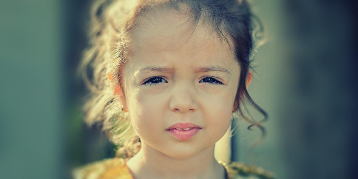 A person looks contemplative or slightly distressed, representing the internal struggle of overthinking anxiety.