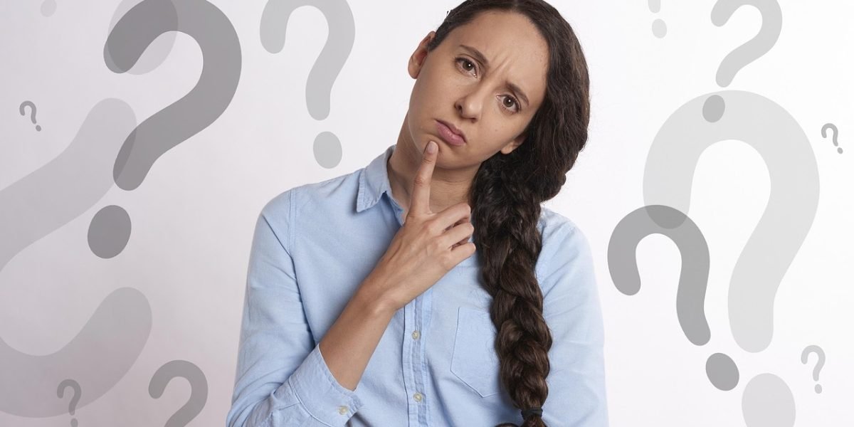 A person looking thoughtful and slightly confused, reflecting the challenge of differentiating complex conditions.