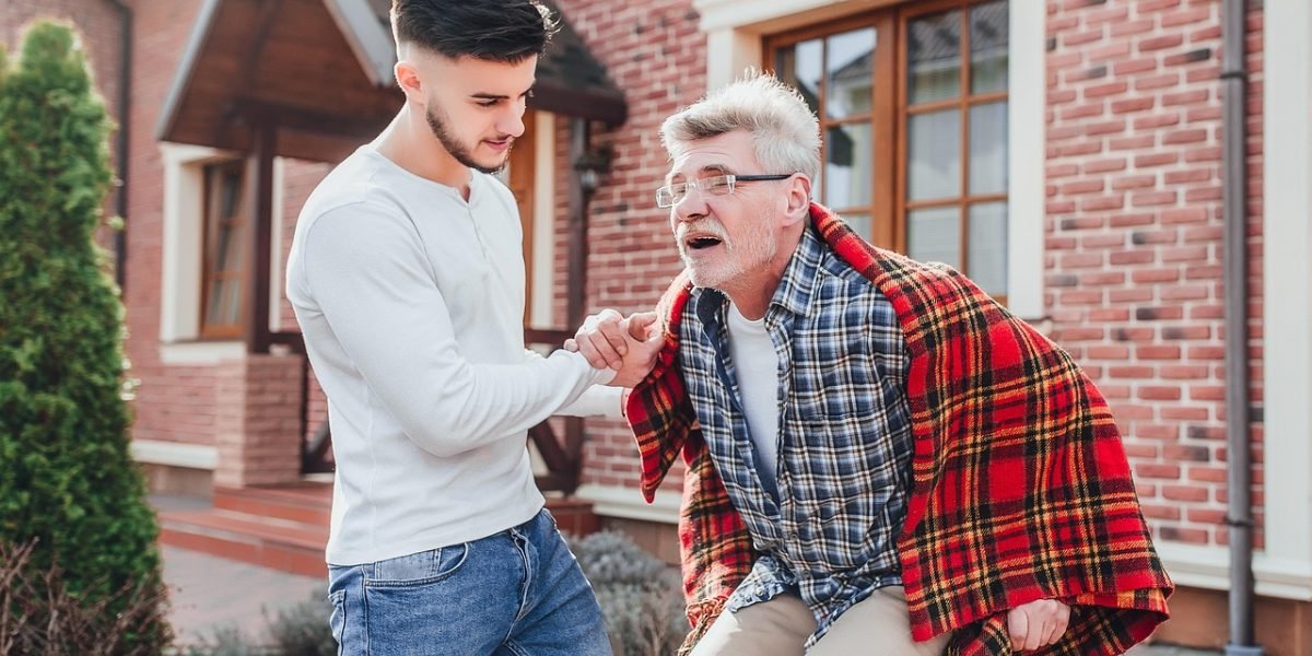 A caregiver provides support to a loved one, emphasizing the importance of compassion and understanding in recovery journeys.