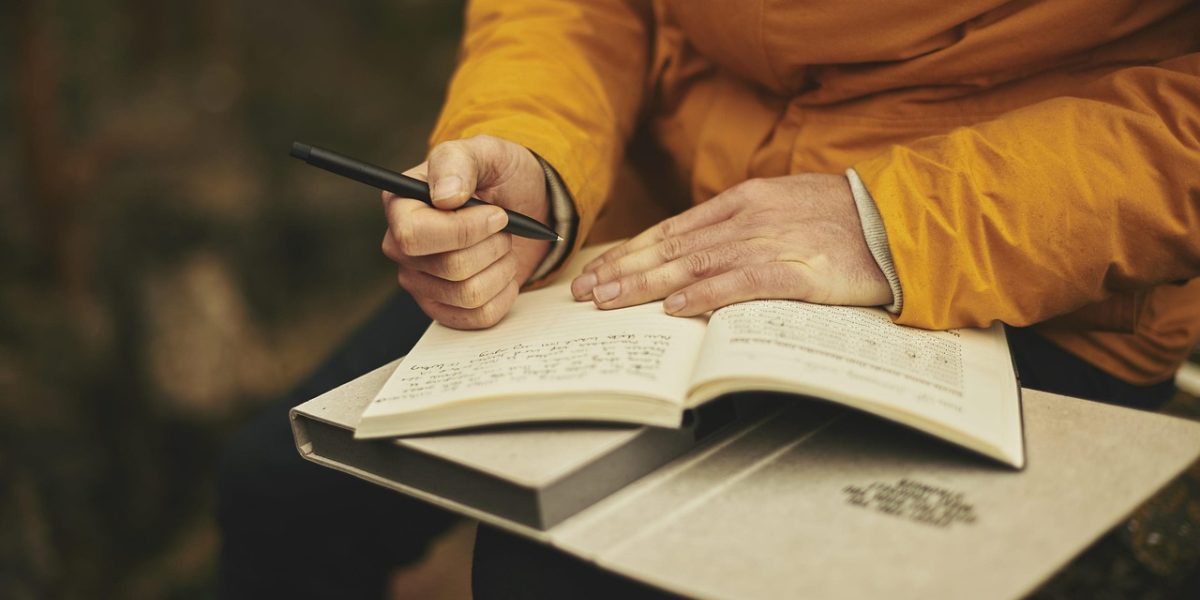 An individual visibly struggling with a daily task like reading or working, highlighting the impact of persistent visual disturbances on daily life.