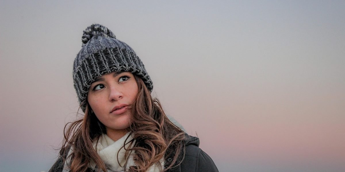 A person in a thoughtful pose, symbolizing internal struggles and the courage to acknowledge mental health needs.