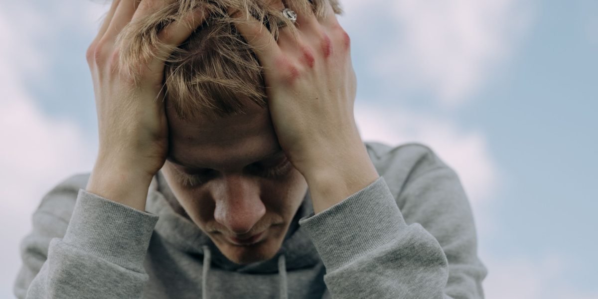 A person experiencing deep thought or stress, reflecting the internal struggle of anxiety.