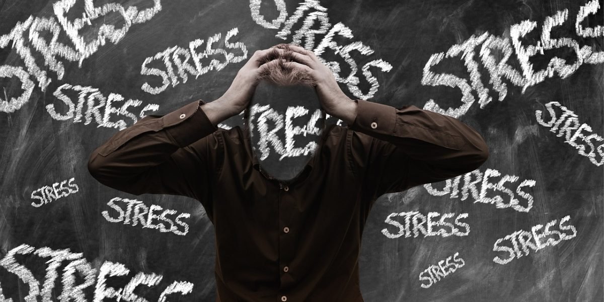 A person looking overwhelmed while researching mental health treatment options online.