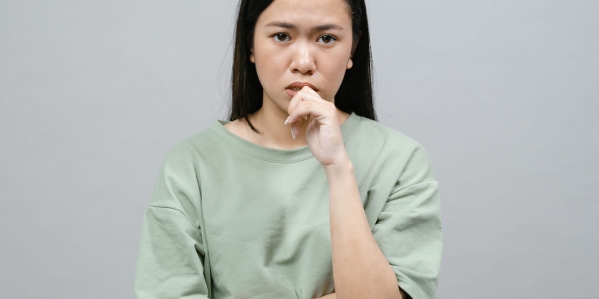A person in deep thought, carefully considering important life decisions or care options.