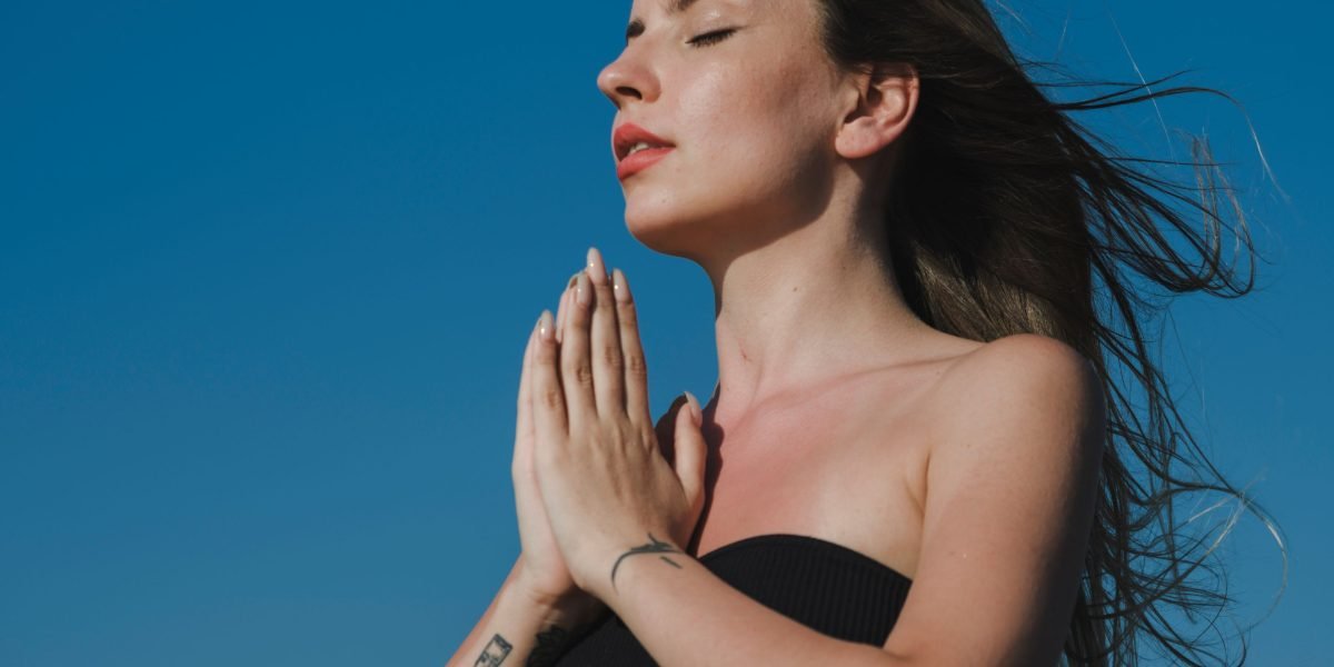 A person calmly practicing deep breathing, demonstrating a moment of control and relaxation.