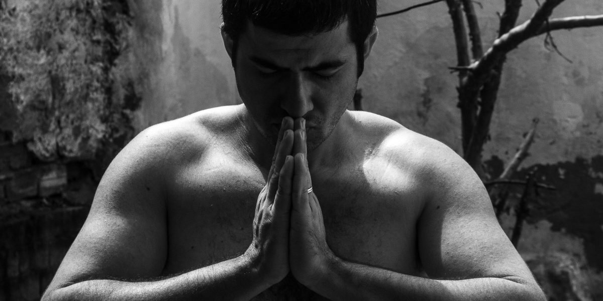 A calm individual reflecting, symbolizing the inner strength and peace found during a journey of recovery and resilience.