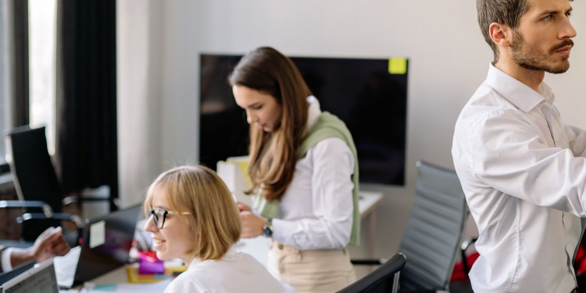 A team of professionals collaborating effectively in an office setting, working on a healthcare-related project.