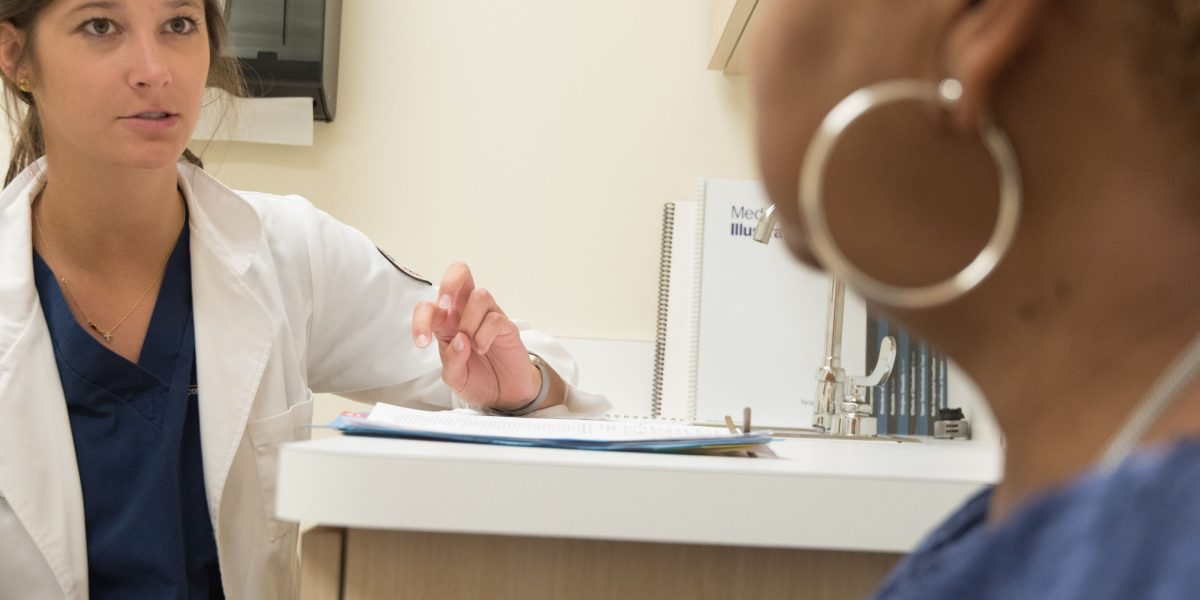 A patient engages in an open conversation with a mental health professional during an assessment.