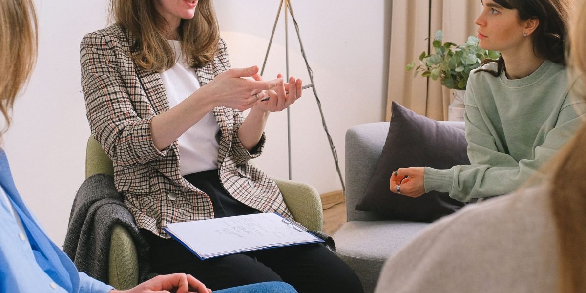 Individuals in a support group share their experiences, fostering connection and mutual understanding.